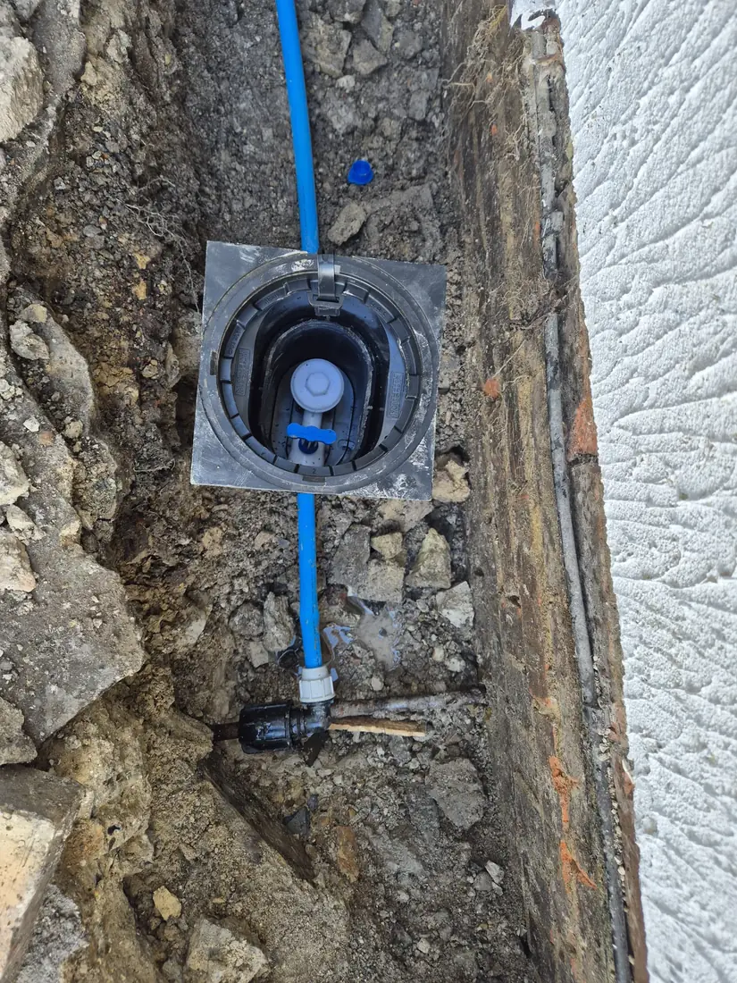 Underground service connection with meter and boundary box