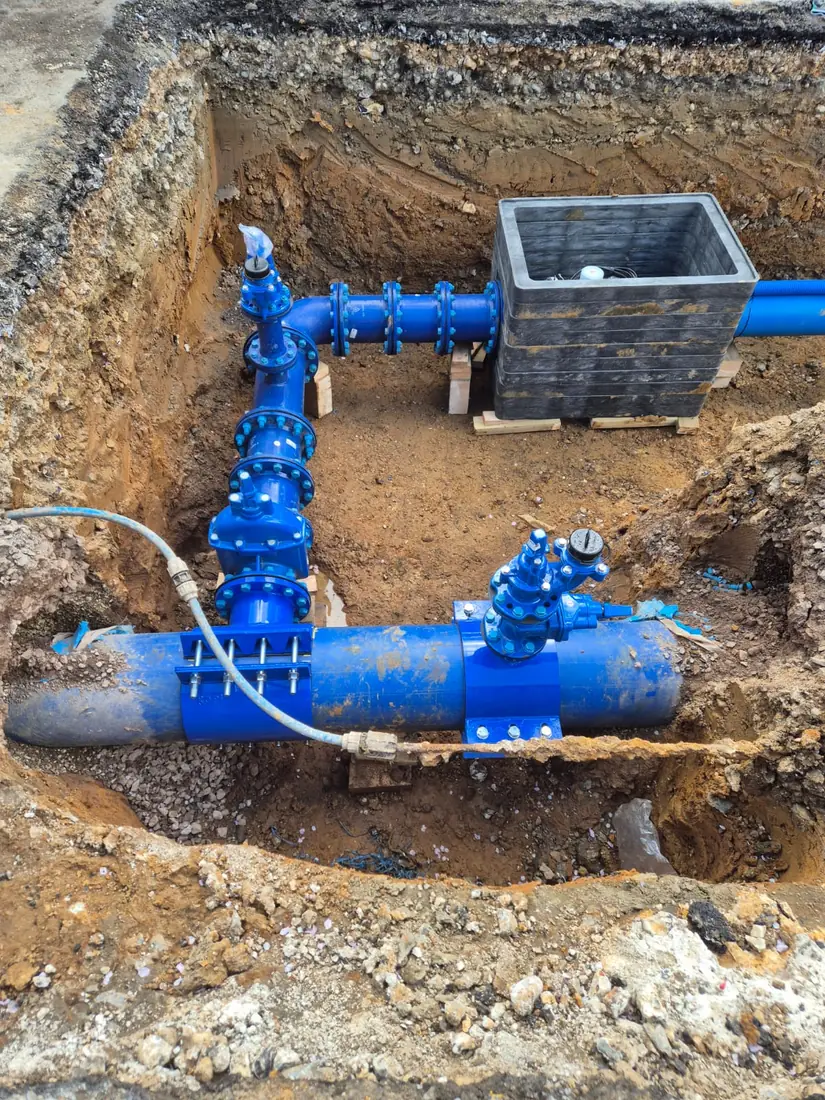 New blue ductile-iron water mains and valves installed by Malling Utilities in an open trench in Kent