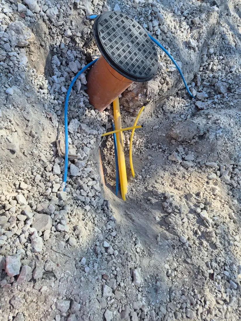Water and gas service pipes to a meter box
